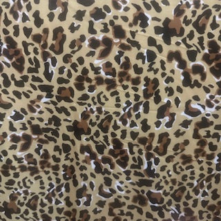 Leopard print pattern on a beige background Polyester Spandex Fabric | Spandex Palace