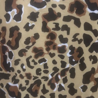 Leopard print pattern on a beige background Polyester Spandex Fabric | Spandex Palace